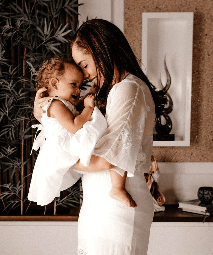 mother and baby dressed in white